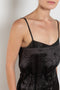 The Little Black Dress by Nackiye is a delicate slip dress with a gathered waist and mesh details