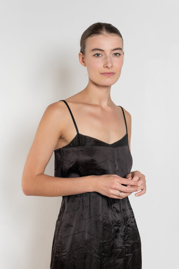 The Little Black Dress by Nackiye is a delicate slip dress with a gathered waist and mesh details