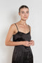 The Little Black Dress by Nackiye is a delicate slip dress with a gathered waist and mesh details