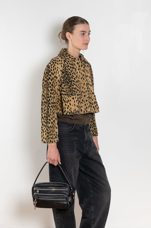 The Pixie Jacket by Nackiye has a cropped silhouette & sleeves with two front pockets and elbow patches