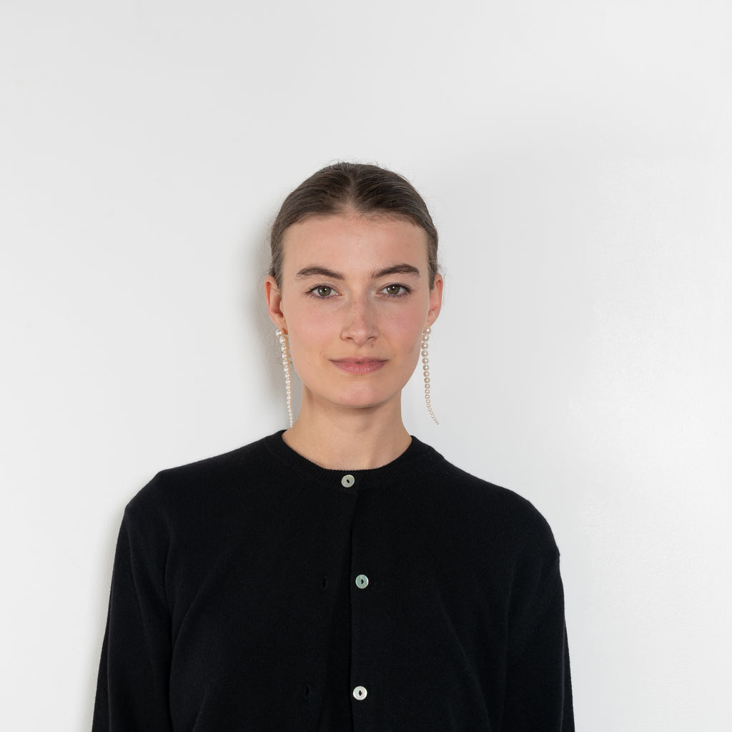 The Sea Shell Cardigan by Nackiye is a beautiful lightweight cashmere cardigan with mother of pearl buttons and lightly ribbed cuffs