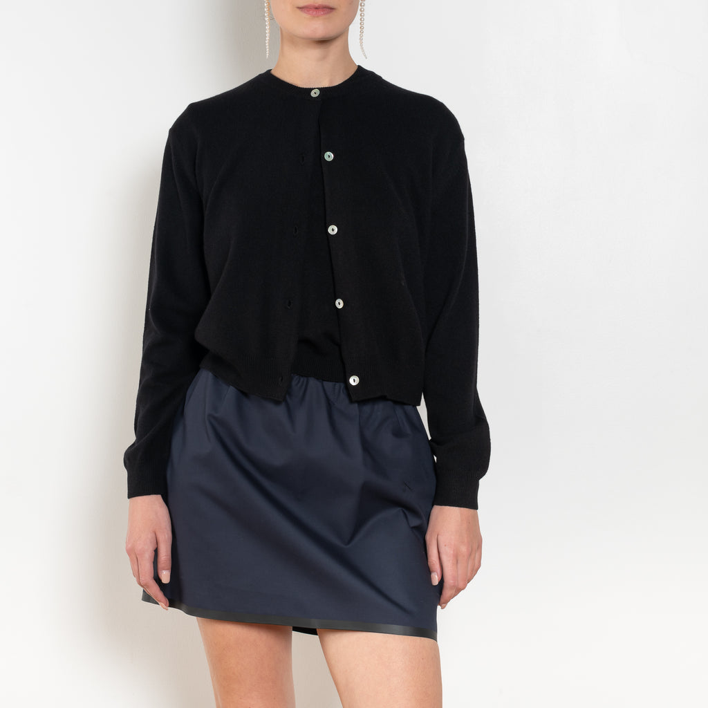 The Sea Shell Cardigan by Nackiye is a beautiful lightweight cashmere cardigan with mother of pearl buttons and lightly ribbed cuffs