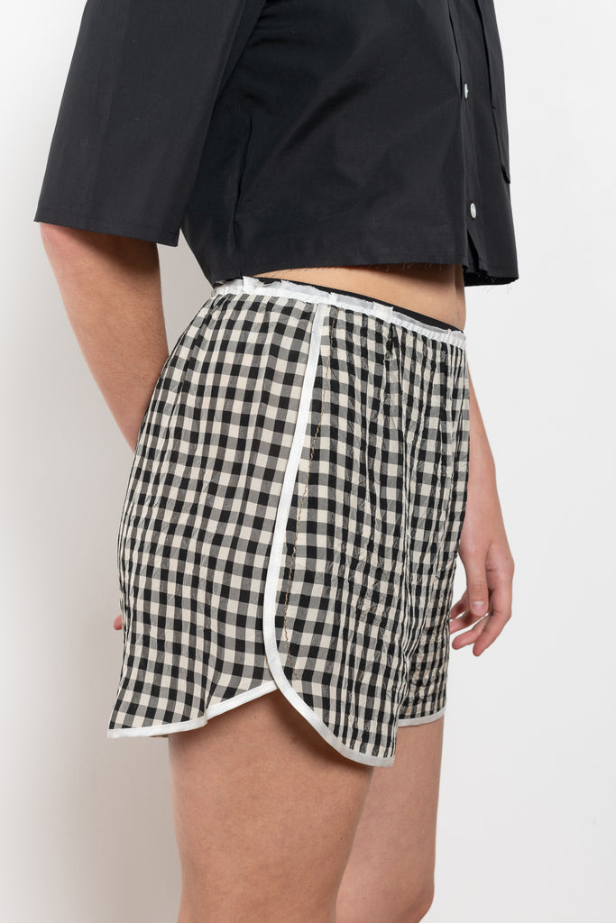 The Short But Sweet Shorts by Nackiye are olympic inspired shorts with piping detail.