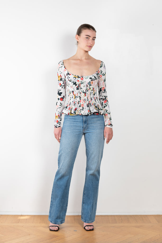 The Floral Peplum Top by Paco Rabanne is a floral top with a bustier upper and peplum details