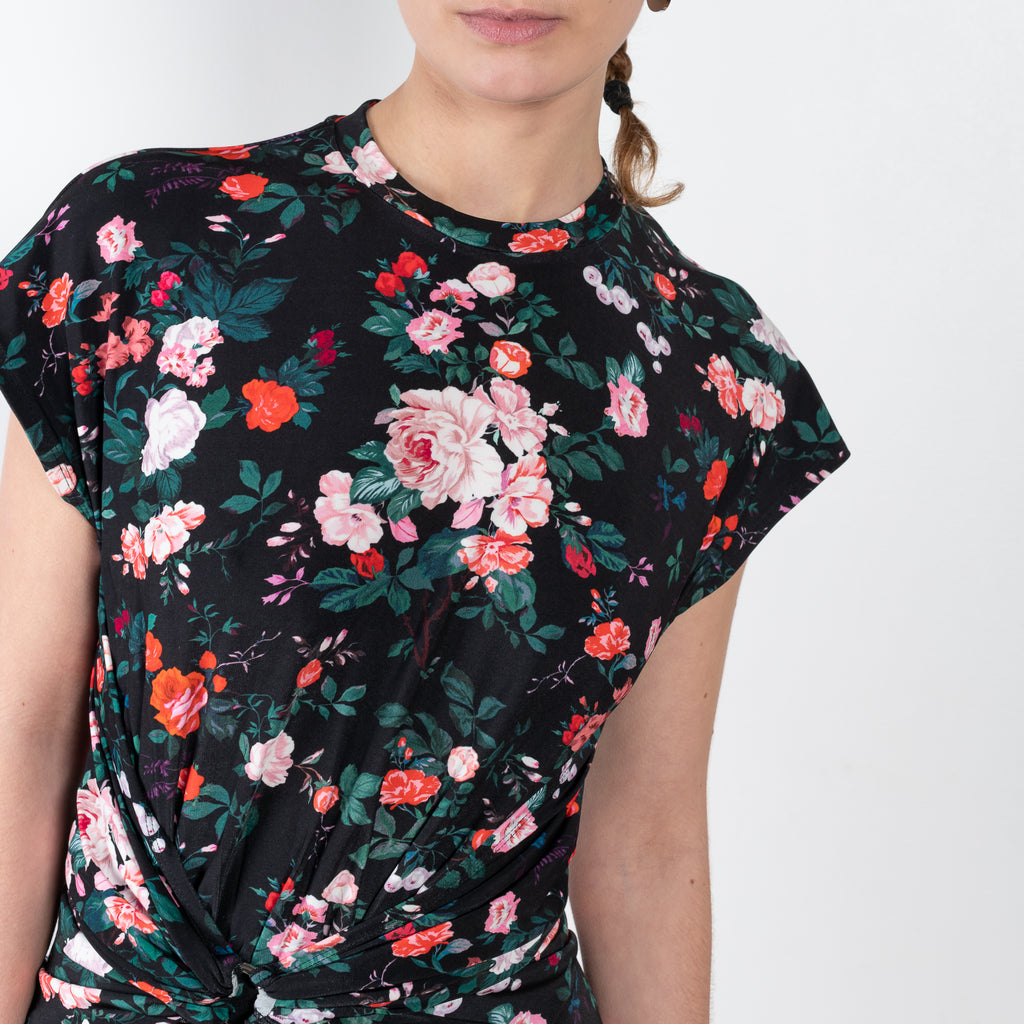 The Floral Dress by Paco Rabanne is a signature floral dress with cap sleeves and a twisted front