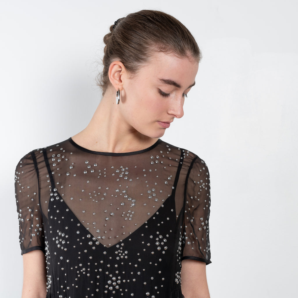 The Silk Studded Dress by Paco Rabanne is a unique and delicate silk chiffon dress with PR signature  all over studs