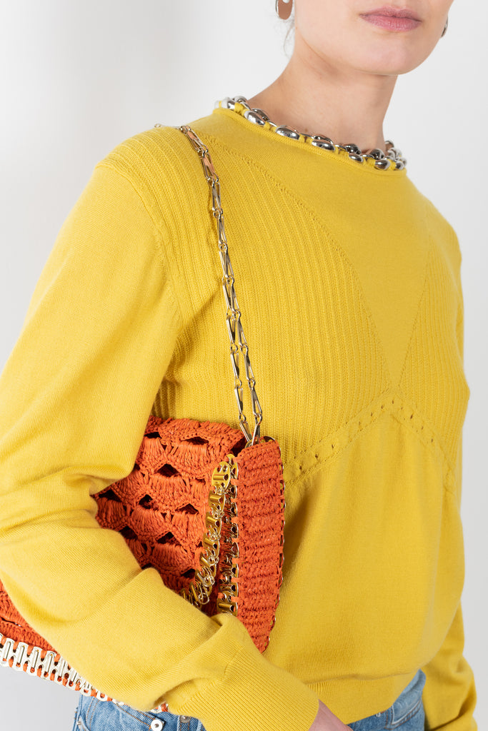 The Chain Knit by Paco Rabanne is a signature knit in bright yellow with chain details in a lightweight summer merino blend