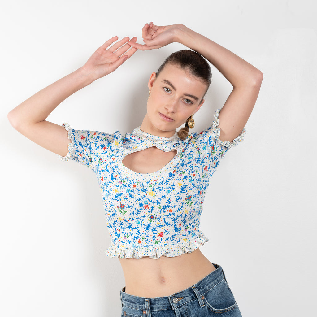 The Floral Cut-out Top by Paco Rabanne is a cropped top in jersey with a front and back cut-out