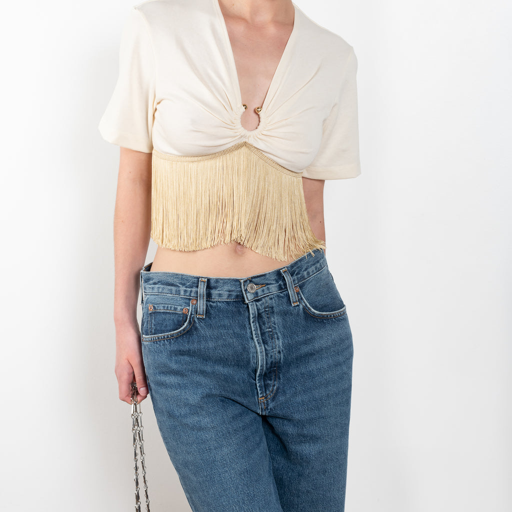 The Fringed Top by Paco Rabanne is a cropped top gathered with a silver ring and fringes 