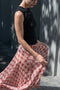 The Kate Pleated Skirt by SS Daley is a long pleated skirt in a silk voile with a delicate check print
