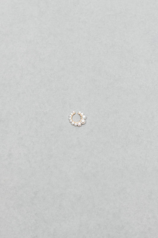 The Cuff De Perle Earcuff by Sophie Bille Brahe is inspired by the Boucle de Perle earrings, this cuff has a flow of graduating freshwater pearls