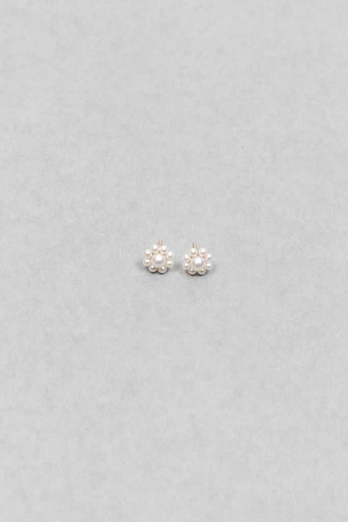 The Margherita Earrings by Sophie Bille Brahe are delicate 14Kt Gold earrings with freshwater pearls arranged to resemble flowers.