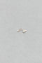 The Stellari Right by Sophie Bille Brahe is a petite version of the Stellari Perle earring with pearls in various sizes placed on a curved gold stem