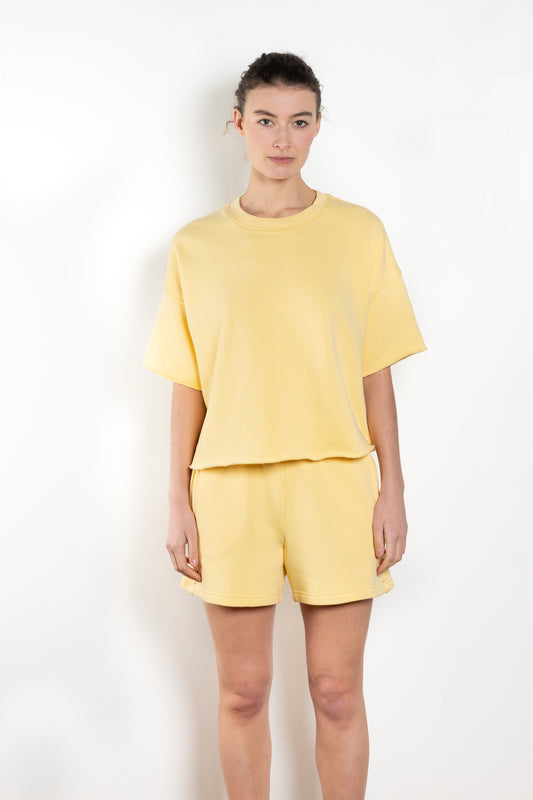 The Romeo Sweatshirt by Xirena is a soft fleece sweater with short sleeves in a slight cropped fit with a raw cut hem