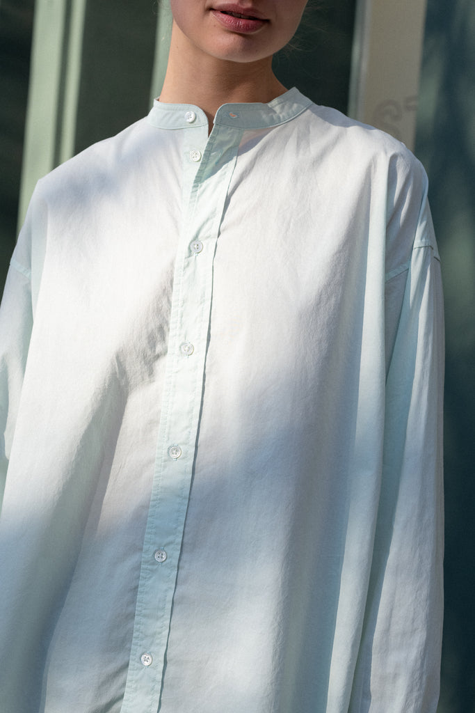 The Band Collar Shirt by 6397 is a signature oversized shirt in a crisp cotton poplin with dropped yoke at the back with gathering detail for volume