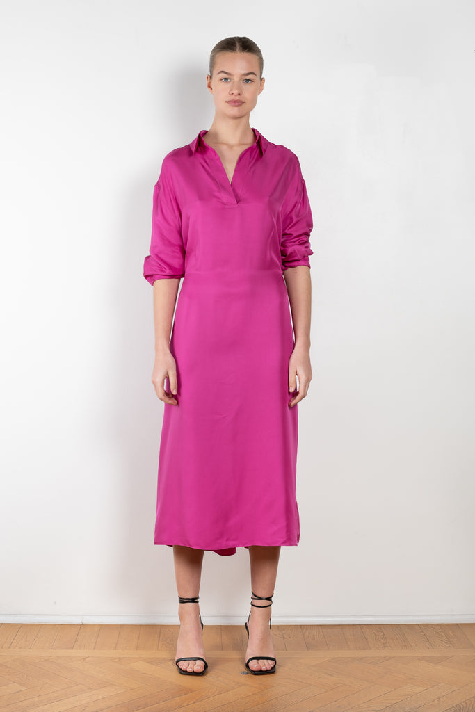The Gathered Polo Dress by 6397 is a flowy dress that can be worn multiple ways in a vibrant fuschia