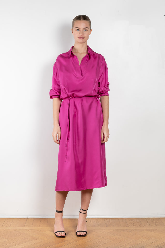 The Gathered Polo Dress by 6397 is a flowy dress that can be worn multiple ways in a vibrant fuschia