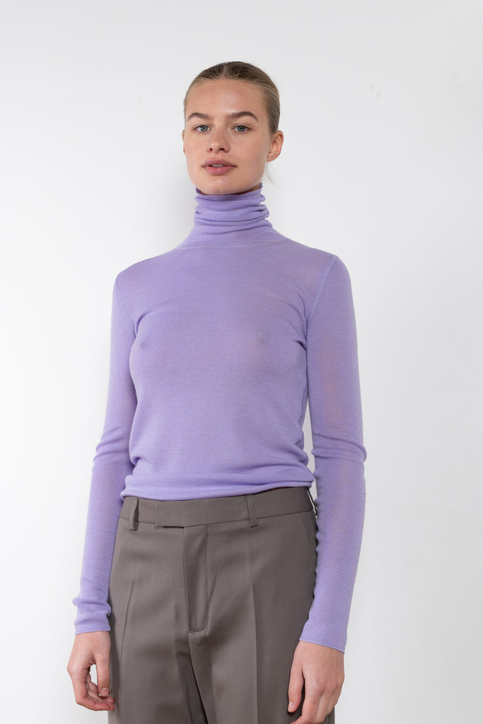The Ribbed T Neck by 6397 is a second skin knit made from Italian extra fine merino 1x1 rib, it hugs the body and feels wonderful on