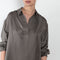 The Gathered Polo Top by 6397 is a flowy top with a polo collar and pleats for added volume on the back
