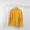 The Everyday Mockneck Sweater by 6397 is a oversized loose knitted sweater in a warm yellow with a high mock neck