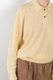 The Slouchy Polo Knit by 6397 is a relaxed yet sophisticated cashmere polo sweater in a pale yellow