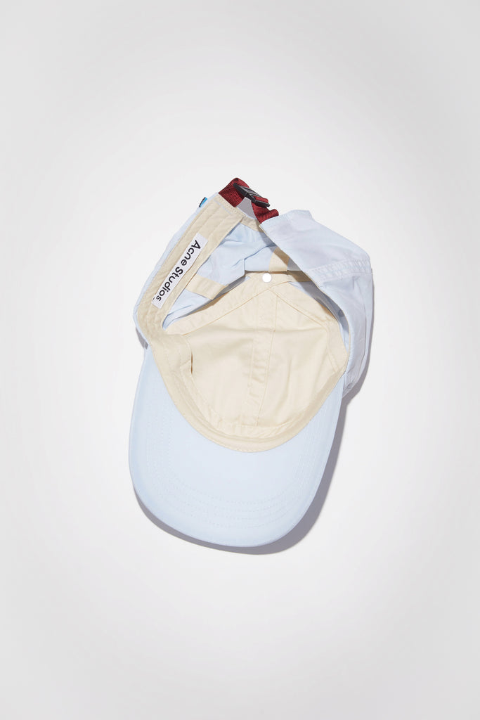 The Nylon Baseball Cap 193 by Acne Studios is a 6 panel baseball cap made of nylon with a contrast lining and fastening