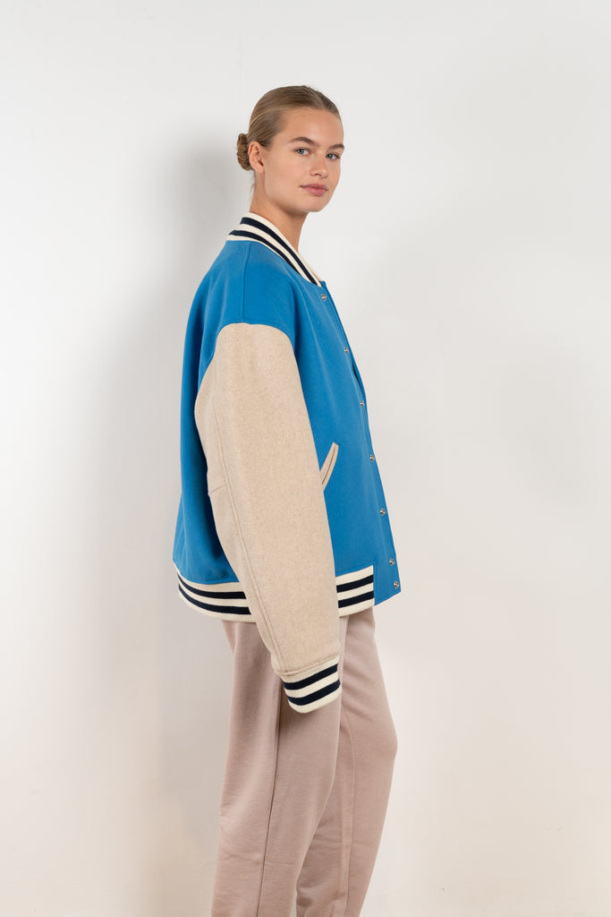 The Wool Bomber 104 by Acne Studios has contrast-coloured sleeves and is detailed with a ribbed neckline, cuffs and hem and adorned with a face logo patch