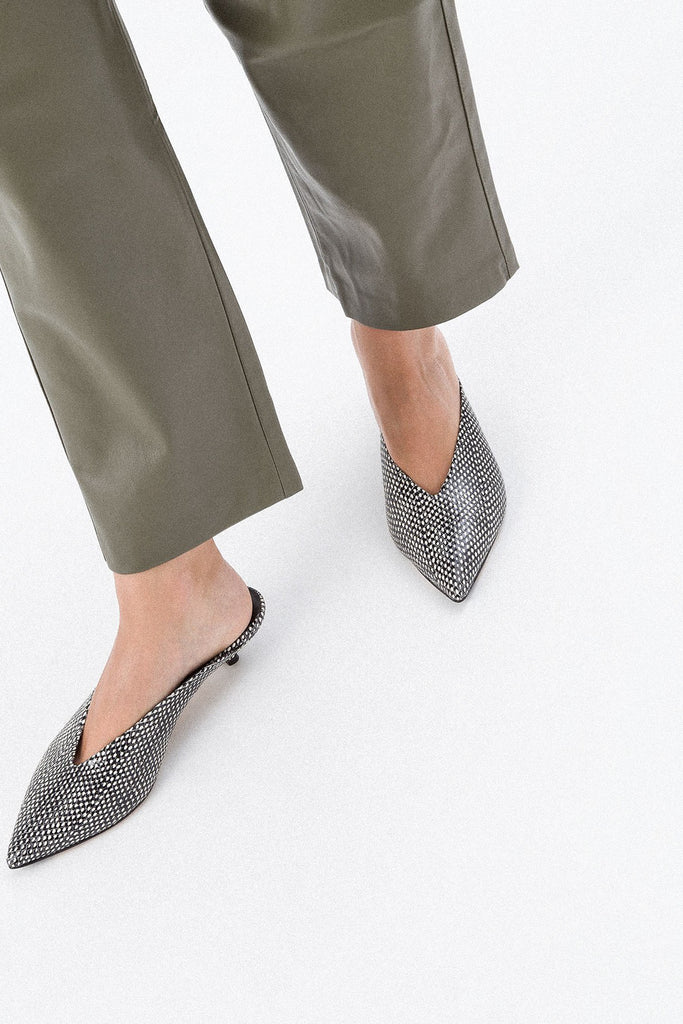 The Veruska Mules by Aeyde are pointy toe mules with a miniature cigarette heel and a sleek v-shaped cut