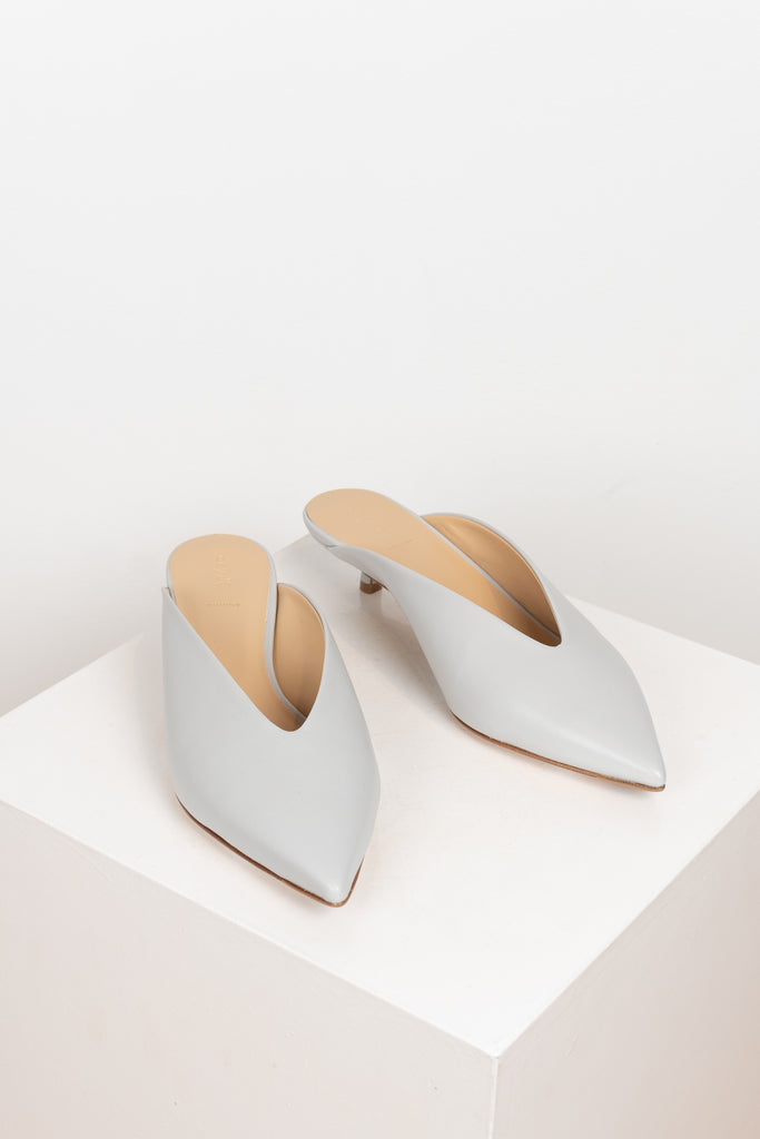 The Veruska Mules by Aeyde are pointy toe mules with a miniature cigarette heel and a sleek v-shaped cut