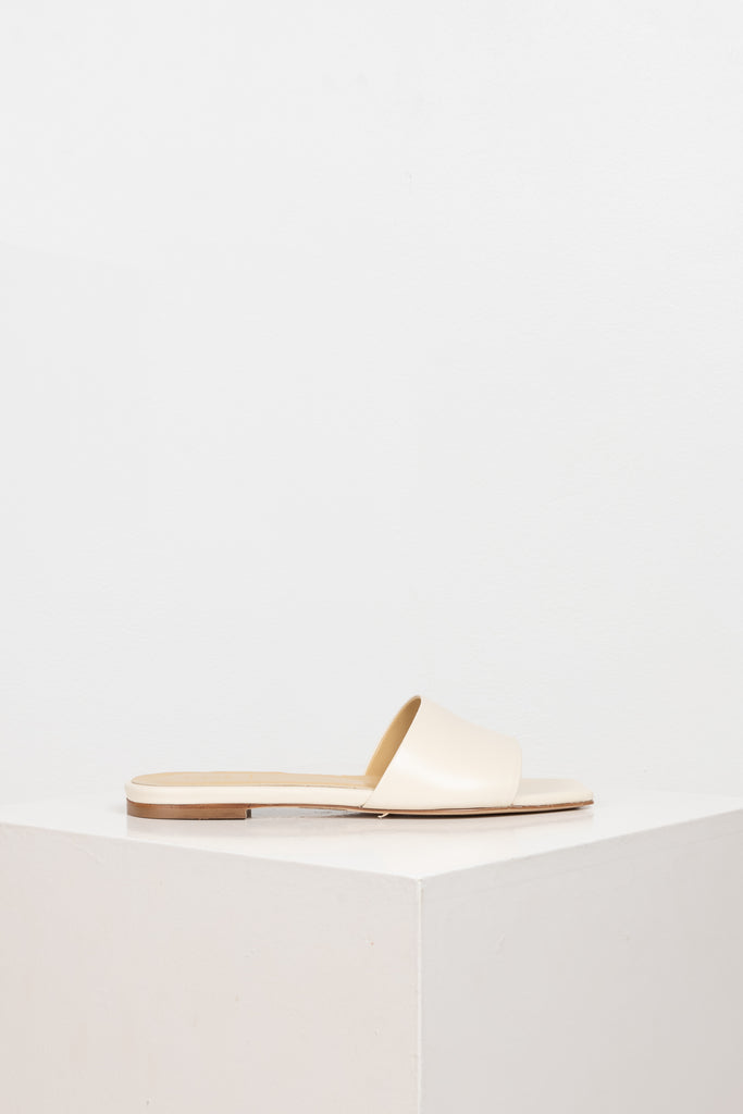 The Anna Slides by Aeyde are iconic lightweight flat slip on sandals with a squared toe, minimal heel in a soft-as-butter nappa