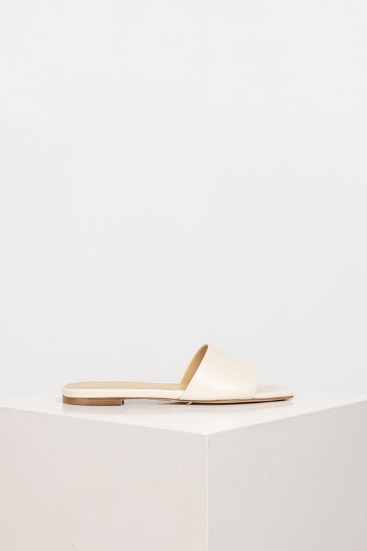 The Anna Slides by Aeyde are iconic lightweight flat slip on sandals with a squared toe, minimal heel in a soft-as-butter nappa