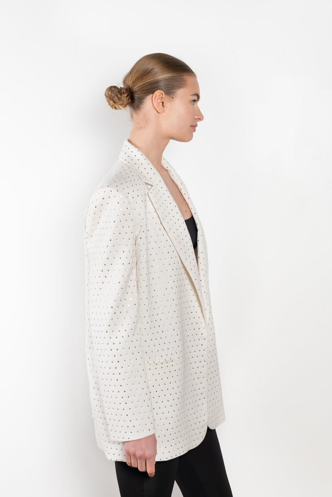 The Guia Blazer by The Andamane is a relaxed oversized blazer with all-over crystals in a bright white