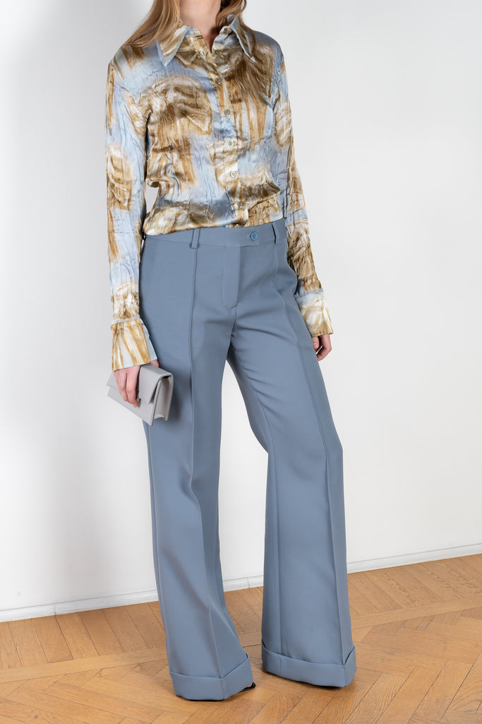 The Tailored Trouser 957 by ACNE STUDIOS is a flared suiting trouser with topstitched front leg pleats and a fold-up hem
