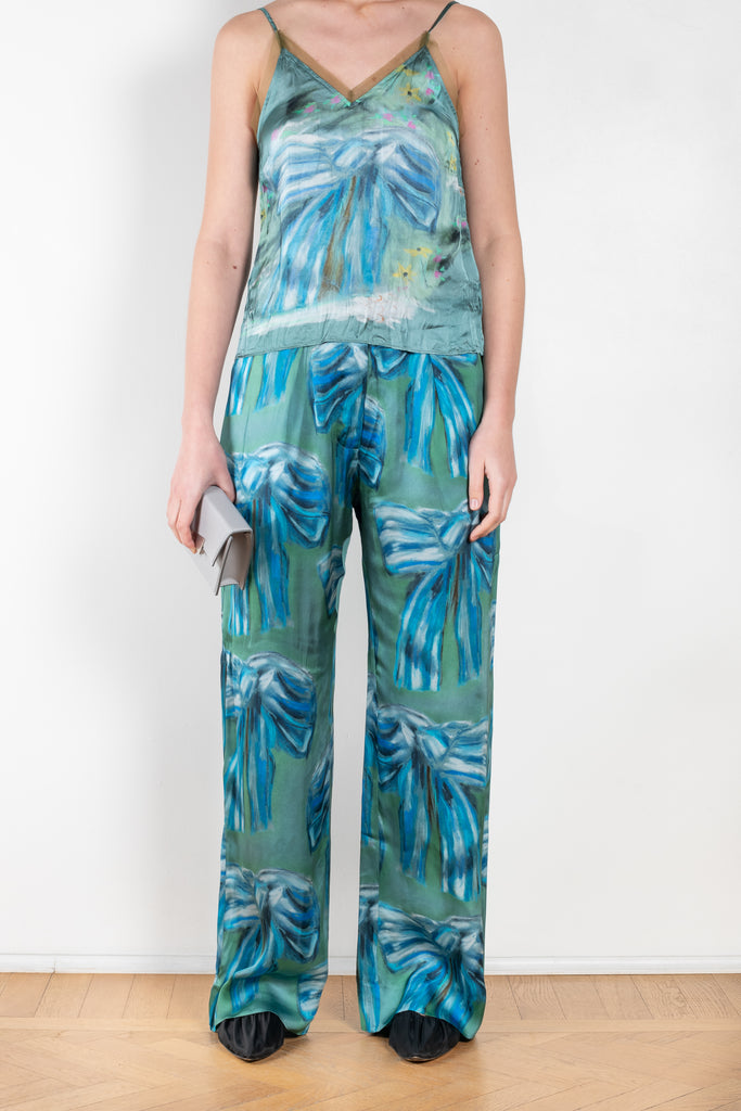 The Bow Print Trouser 1011 by Acne Studios is a crinkled trouser in a bow print by artist Karen Kilimnik with a loose volume on the leg