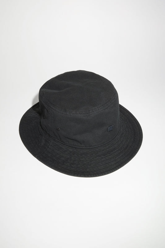 The Cotton Bucket Hat 107 by Acne Studios is a black bucket hat made out of peachy hand feel cotton with faded effect fabric