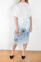 The Print Cat Skirt 502 is a high waisted midi skirt made from a satin fabric with a crinkled luminous and fluid appearance and a seasonal print by artist Karen Kilimnik