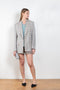The Check Suit Jacket 462 by Acne Studios is a single-breasted blazer made from a linen blend and in an all-over gingham print