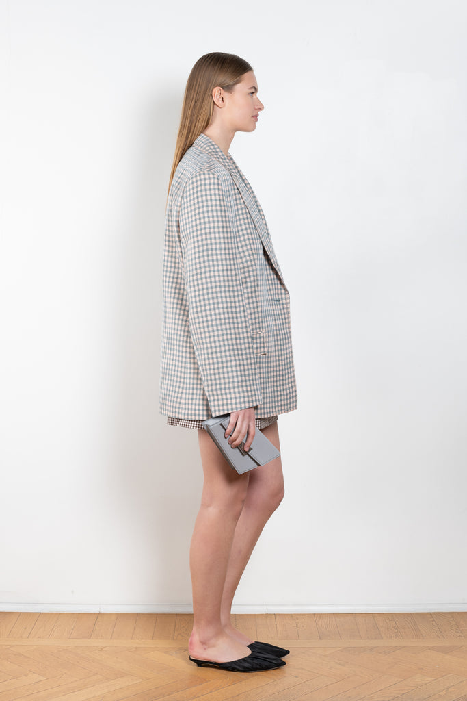 The Check Suit Jacket 462 by Acne Studios is a single-breasted blazer made from a linen blend and in an all-over gingham print