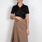 The Ine Chino Skirt by Acne Studios is a high waisted chino midi skirt in a light brown cotton