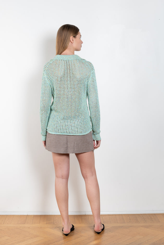 The Knitted Polo Shirt 547 by ACNE STUDIOS is a aqua blue polo jumper in a knitted tonal yarn with a crochet knit finish and a semi-sheer appearance