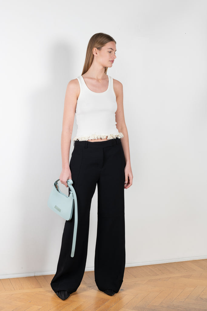 The Panneled Trouser 945 by Acne Studios is a relaxed black tailored trousers with topstitched panneled details and a fold-up hem