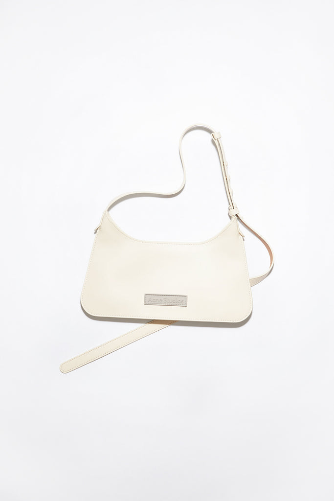 The Platt Mini Bag by  ACNE STUDIOS has a minimalistic silhouette with sculptural folds at the base and sides