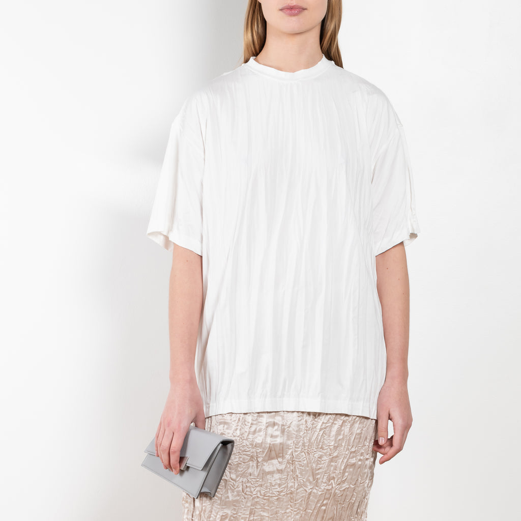 The Pleated Tshirt 516 by Acne Studios is a relaxed Tee made from from light lycra with a pleated finish and detailed with a seasonal logo on the side seam