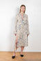 The Printed Wrap Dress 907 by Acne Studios has a relaxed fit with elongated flared sleeves and a mid-length in a faded flower print