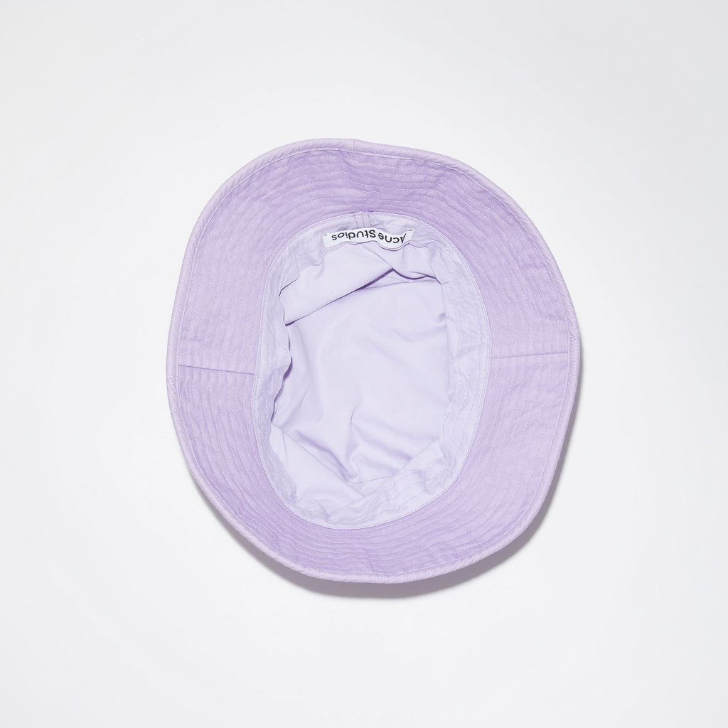 The Twill Bucket Hat 149 by Acne Studios is a lilac bucket hat made out of cotton twill with eyelets, the perfect summer partnerThe Twill Bucket Hat 149 by Acne Studios is a lilac bucket hat made out of cotton twill with eyelets, the perfect summer partner
