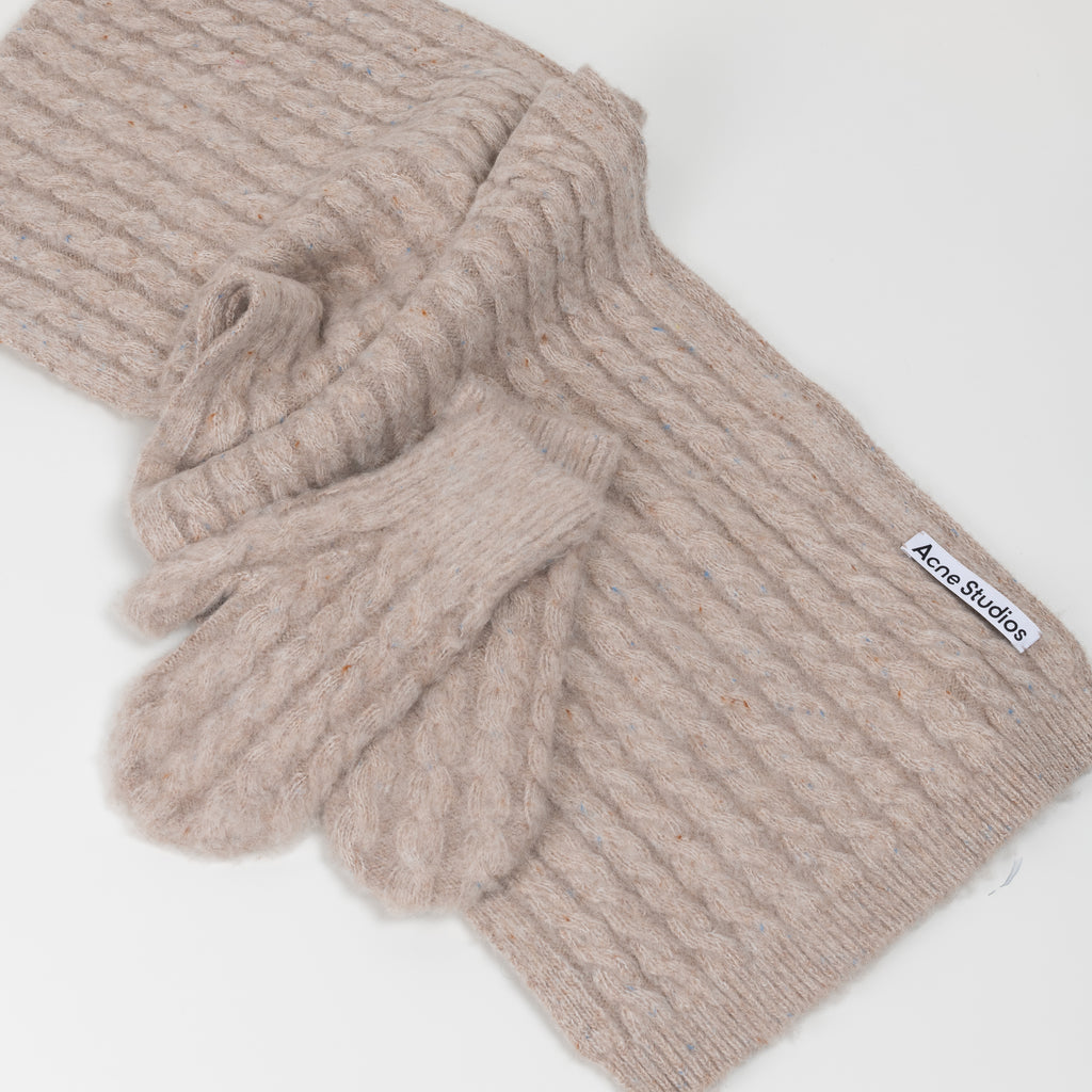 The Cable Knit Mittens 29  by Acne Studios are soft wool cable mittens with a ribbed cuff