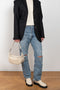 The 90'S Jeans by Agolde in color streamline is a relaxed mid rise straight leg jeans in a distressed mid blue wash