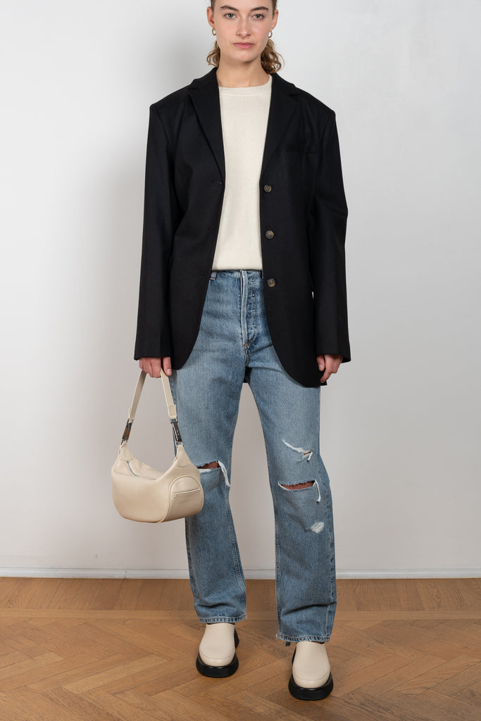 The 90'S Jeans by Agolde in color streamline is a relaxed mid rise straight leg jeans in a distressed mid blue wash