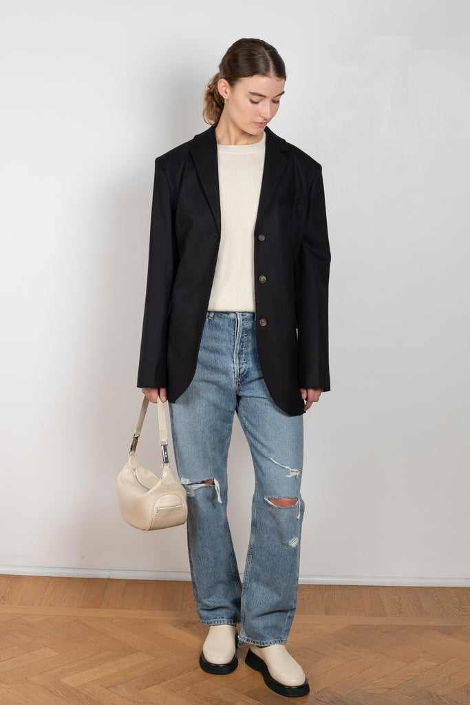 The 90'S Jeans by Agolde in color streamline is a relaxed mid rise straight leg jeans in a distressed mid blue wash