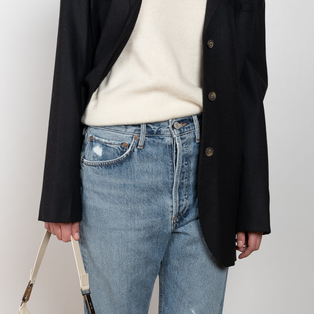 The 90'S Jeans by Agolde in color streamline is a relaxed mid rise straight leg jeans in a distressed mid blue wash